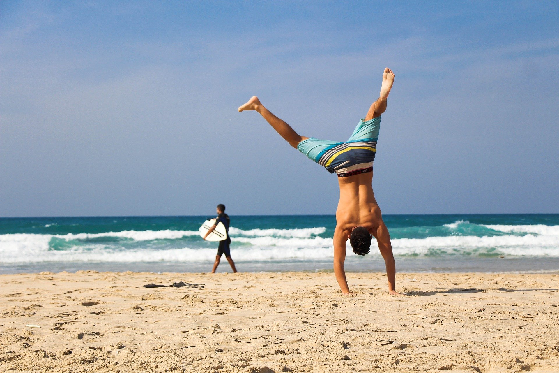 handstand on the beach